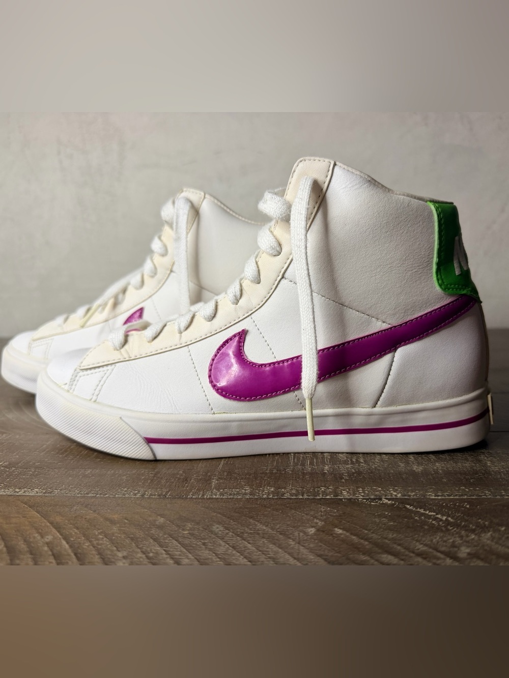 Nike Women’s White High-Top Sneakers with Purple Swoosh